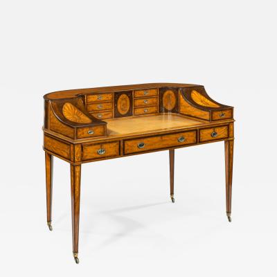 A late Victorian freestanding satinwood Carlton House desk
