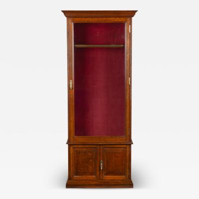 A late Victorian oak gun cabinet