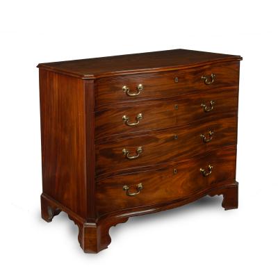 A mahogany four drawer serpentine chest of drawers