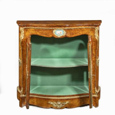 A mid Victorian kingwood serpentine cabinet