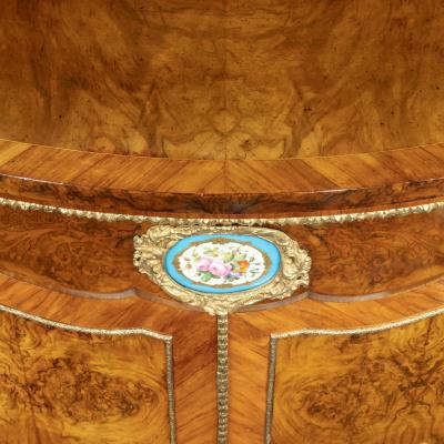 A mid Victorian kingwood serpentine cabinet