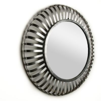A mid century modern round industrial style mirror silver coated circa 1960