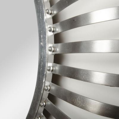 A mid century modern round industrial style mirror silver coated circa 1960