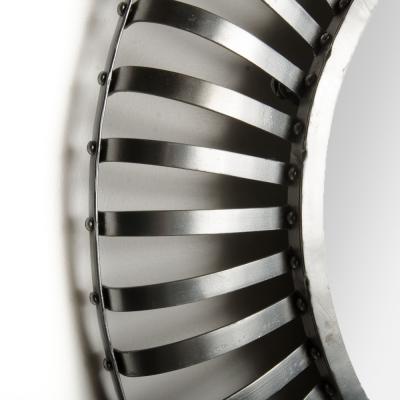 A mid century modern round industrial style mirror silver coated circa 1960