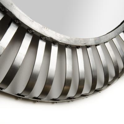 A mid century modern round industrial style mirror silver coated circa 1960