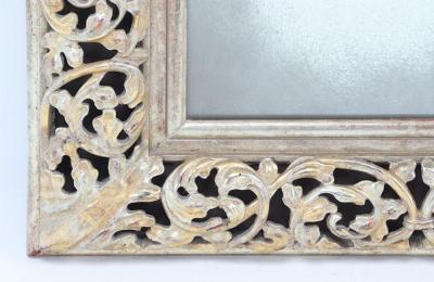 A modern silver gilt carved wood mirror 