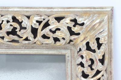 A modern silver gilt carved wood mirror 