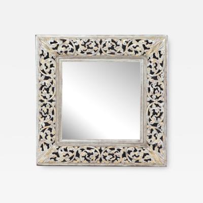 A modern silver gilt carved wood mirror 