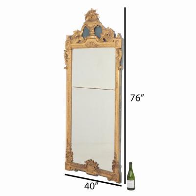 A monumental French Louis XVI style ornate giltwood mirror C 1850 