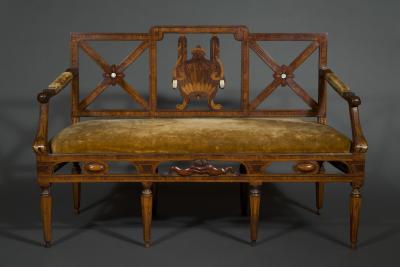 A most unusual set of four neoclassical marquetry inlaid chairs and a settee