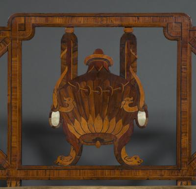 A most unusual set of four neoclassical marquetry inlaid chairs and a settee