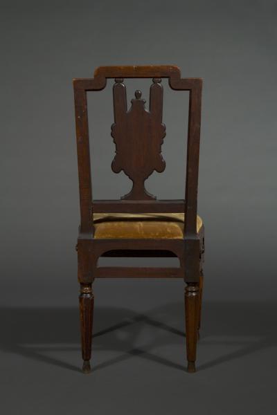 A most unusual set of four neoclassical marquetry inlaid chairs and a settee