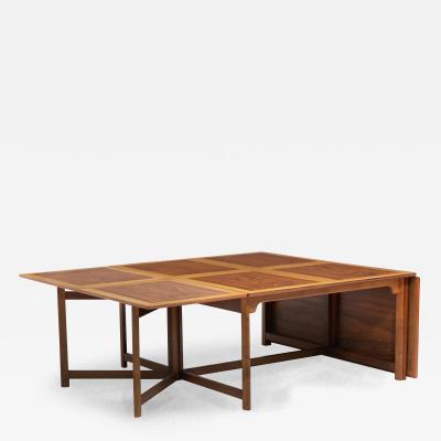 A multifunctional library or dining table of figured and straight grained walnut