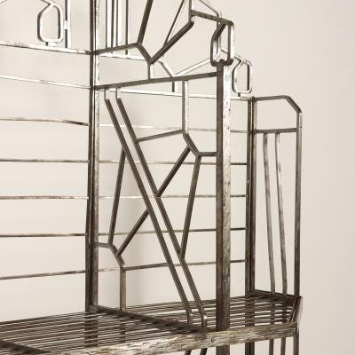 A nickel over iron Art Deco bakers rack with glass shelves French C 1930 