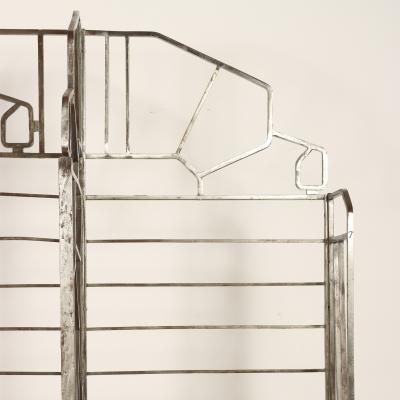 A nickel over iron Art Deco bakers rack with glass shelves French C 1930 