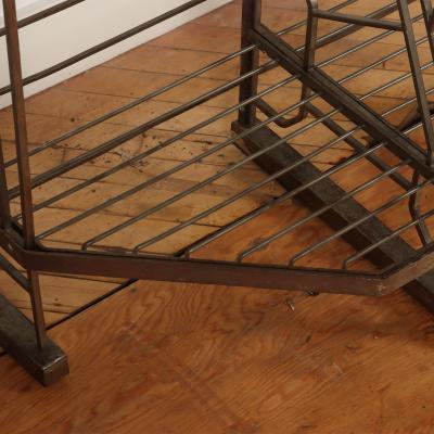 A nickel over iron Art Deco bakers rack with glass shelves French C 1930 