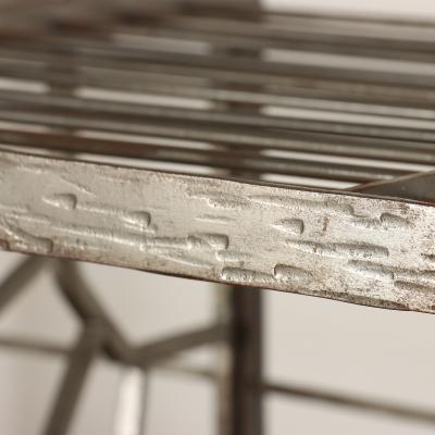 A nickel over iron Art Deco bakers rack with glass shelves French C 1930 