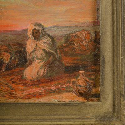 A oil on board painting of Bedouin men on beach in sunset signed indistinctly 