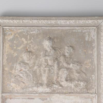 A painted French wall panel with plaster relief having three cherubs circa 1900 