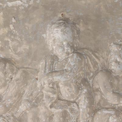 A painted French wall panel with plaster relief having three cherubs circa 1900 
