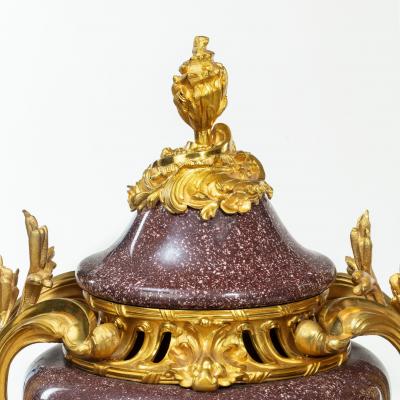 A pair Napoleon III Egyptian imperial porphyry urns and covers