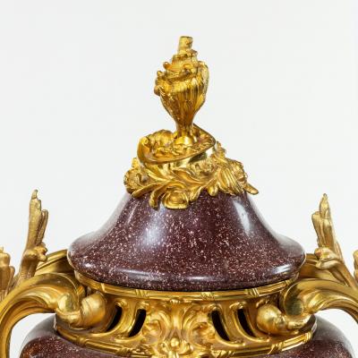 A pair Napoleon III Egyptian imperial porphyry urns and covers