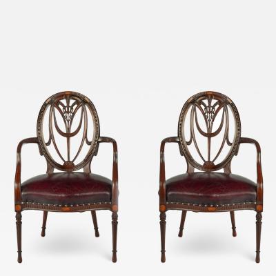 A pair mahogany Hepplewhite style arm chairs