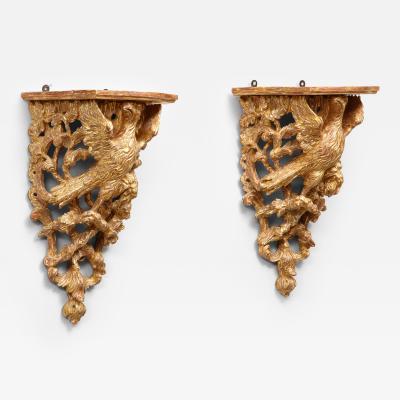 A pair of 19th century carved and gilded brackets