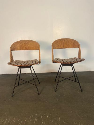 A pair of Arthur Umanoff Swiveling side chairs