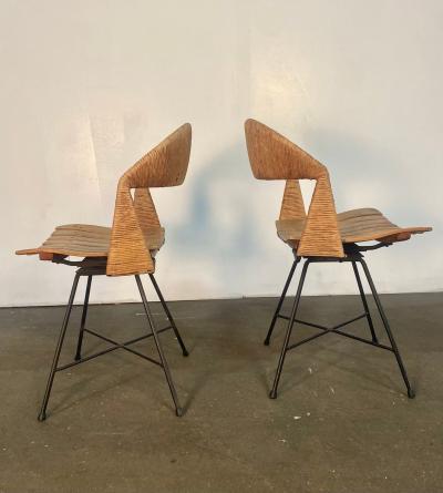 A pair of Arthur Umanoff Swiveling side chairs