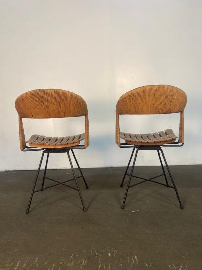 A pair of Arthur Umanoff Swiveling side chairs