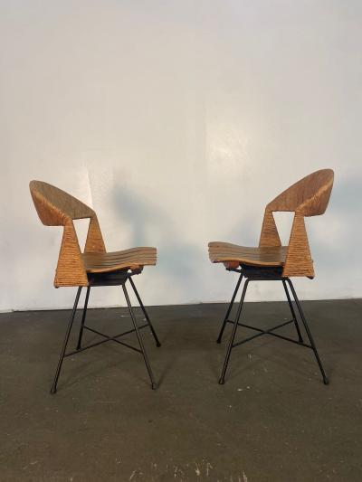A pair of Arthur Umanoff Swiveling side chairs