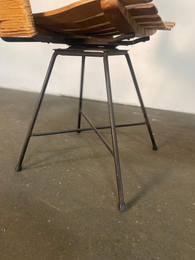 A pair of Arthur Umanoff Swiveling side chairs