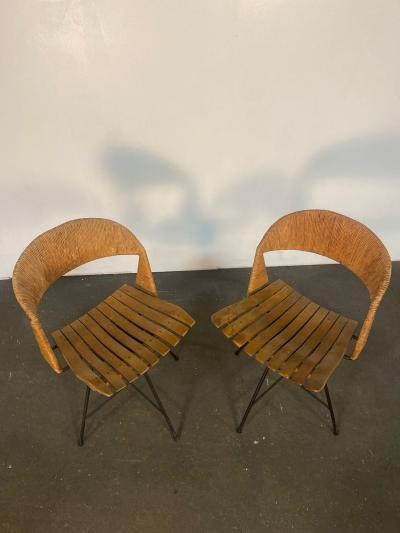 A pair of Arthur Umanoff Swiveling side chairs
