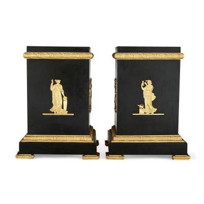 A pair of Empire style Neoclassical gilt and patinated bronze stands