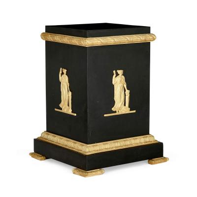 A pair of Empire style Neoclassical gilt and patinated bronze stands