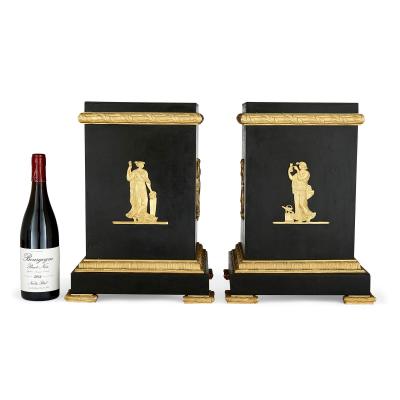A pair of Empire style Neoclassical gilt and patinated bronze stands