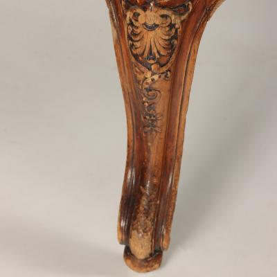 A pair of French Louis XV style carved Bergeres A oreilles C 1900 