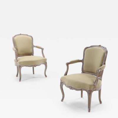A pair of French Louis XV style painted open armchairs circa 1900 