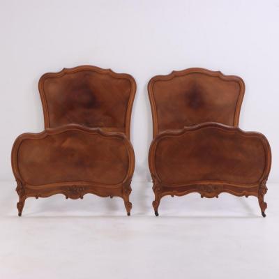 A pair of French Louis XV style walnut twin beds C 1900 