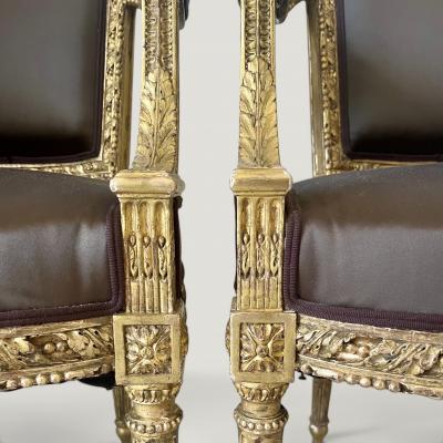 A pair of French Louis XVI Carved Giltwood fauteuils late 18th century Stamped