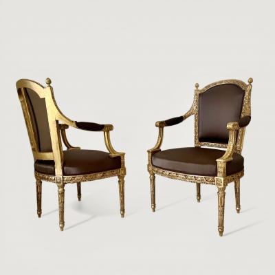A pair of French Louis XVI Carved Giltwood fauteuils late 18th century Stamped