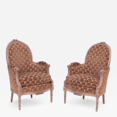 A pair of French Louis XVI style painted wood armchairs or bergeres C 1920