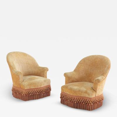 A pair of French Napoleon III lounge chairs C 1860 