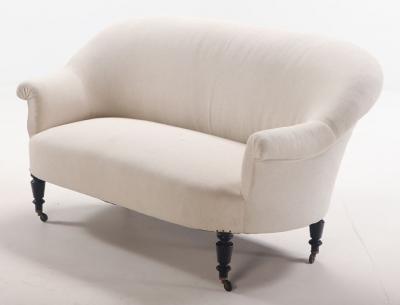 A pair of French Napoleon III sofas with continuous backs circa 1860 