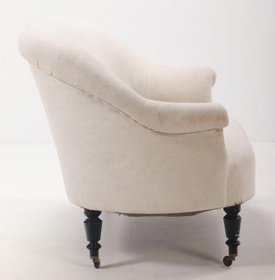 A pair of French Napoleon III sofas with continuous backs circa 1860 