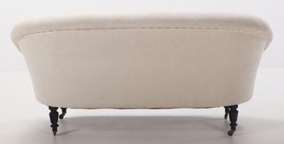 A pair of French Napoleon III sofas with continuous backs circa 1860 