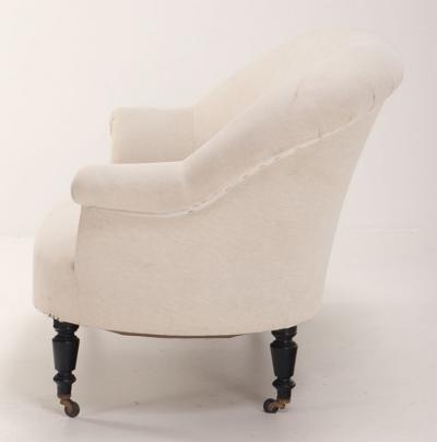 A pair of French Napoleon III sofas with continuous backs circa 1860 