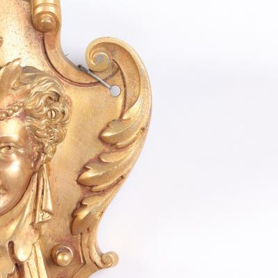 A pair of French Neoclassical style gilt bronze sconces having classical masks 