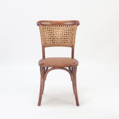A pair of French Vintage oak side chairs with rattan backs and seats